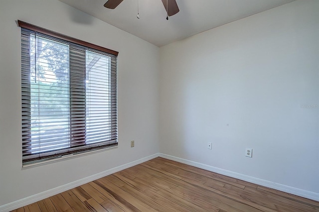 unfurnished room with light hardwood / wood-style flooring, ceiling fan, and plenty of natural light