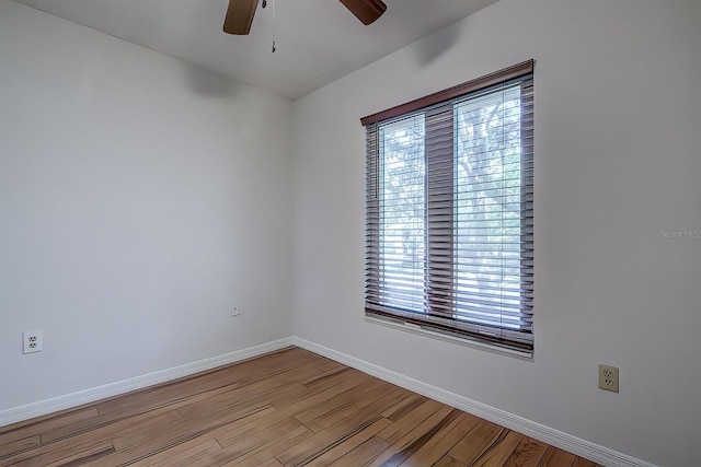 empty room featuring ceiling fan and light hardwood / wood-style flooring