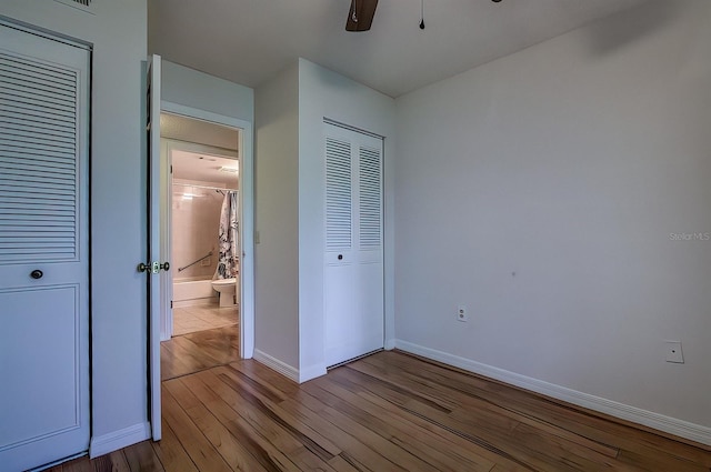 unfurnished bedroom with a closet, ceiling fan, and light wood-type flooring