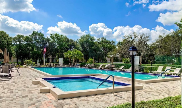 view of swimming pool with a patio area