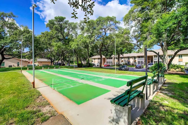 view of home's community featuring a yard