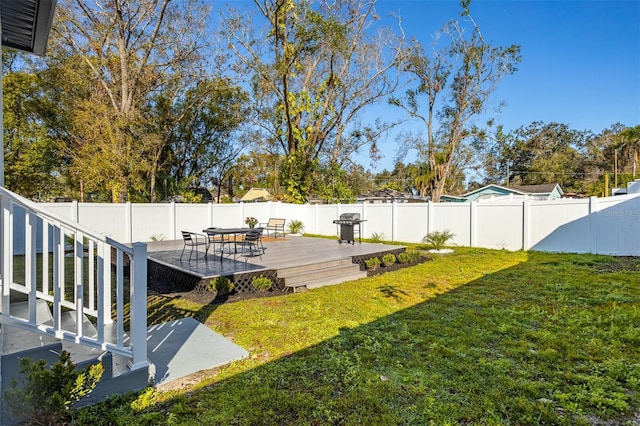 view of yard with a wooden deck