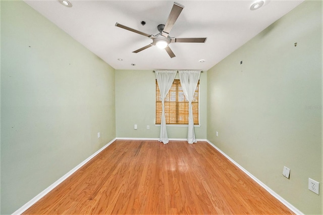 unfurnished room featuring ceiling fan and light hardwood / wood-style floors