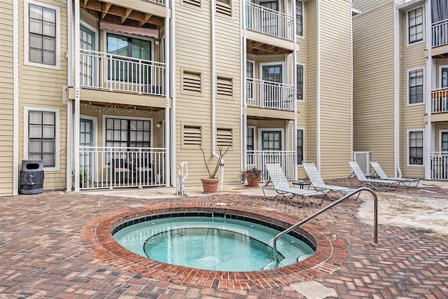 view of pool with a community hot tub