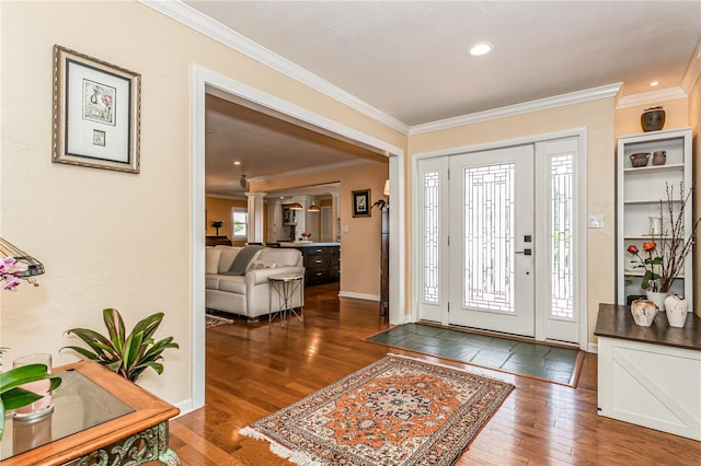 foyer featuring recessed lighting, baseboards, crown molding, and hardwood / wood-style floors