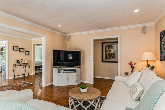 living area with baseboards, dark wood-style floors, ornamental molding, a textured ceiling, and recessed lighting