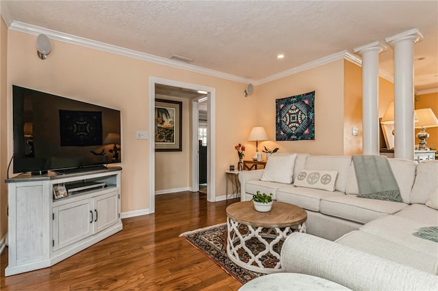 living room with ornate columns, visible vents, baseboards, dark wood-style floors, and crown molding