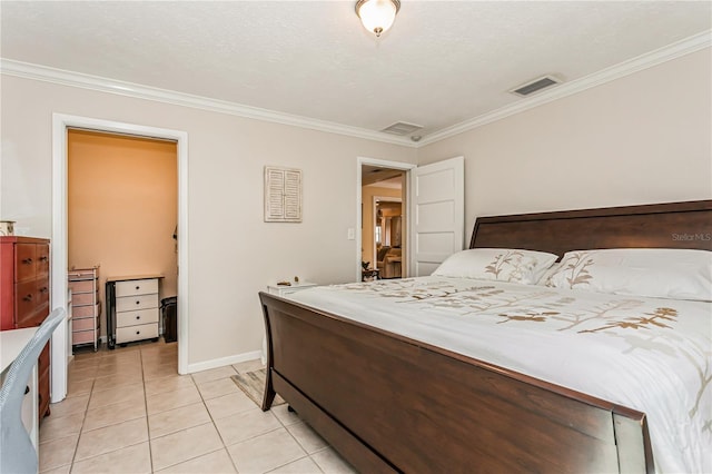 bedroom with baseboards, light tile patterned flooring, visible vents, and crown molding