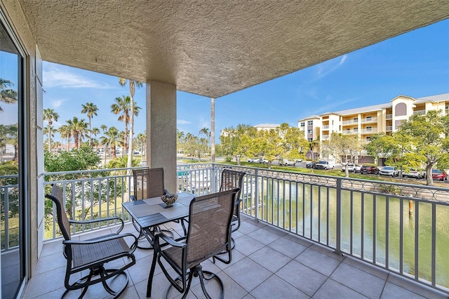 balcony featuring a water view