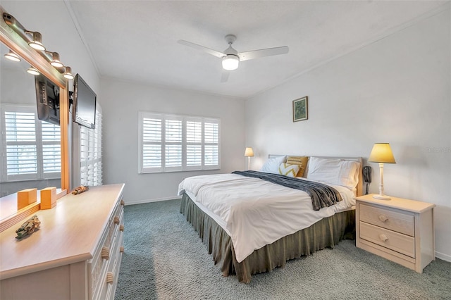 bedroom featuring light carpet, a ceiling fan, and baseboards