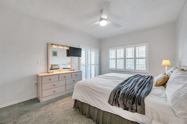 bedroom with light carpet, a ceiling fan, and baseboards