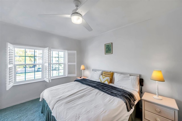 bedroom with carpet floors, baseboards, and a ceiling fan