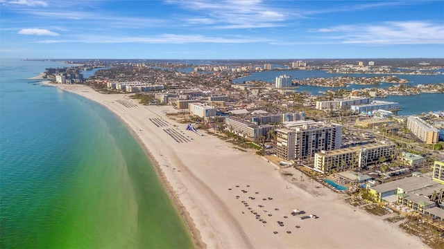 drone / aerial view featuring a water view and a beach view