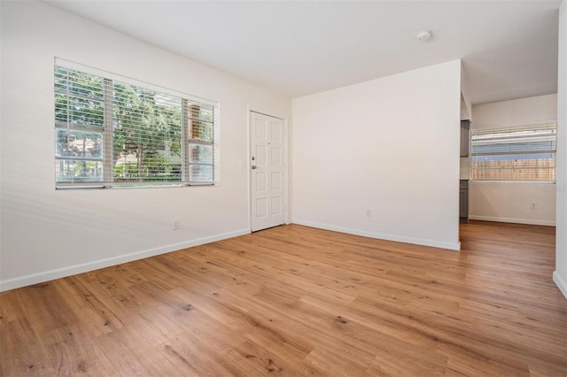 unfurnished room featuring light hardwood / wood-style flooring