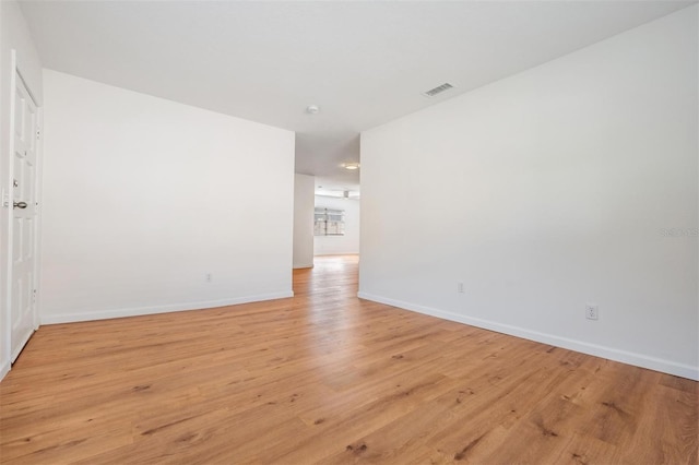 unfurnished room featuring light hardwood / wood-style floors