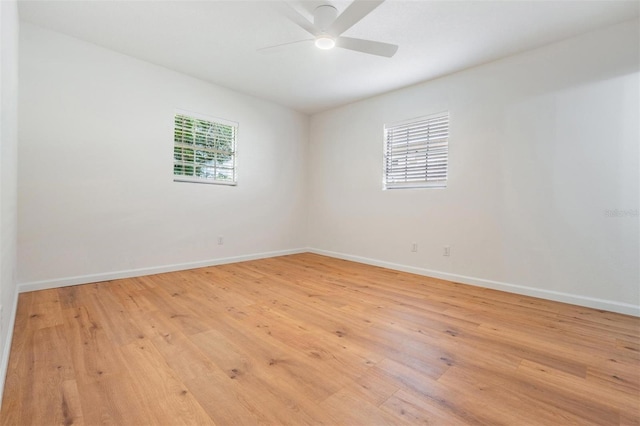 unfurnished room with plenty of natural light, ceiling fan, and light hardwood / wood-style flooring