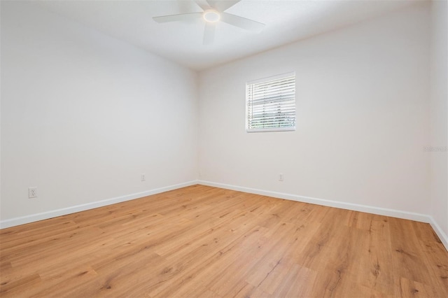 empty room with ceiling fan and light wood-type flooring