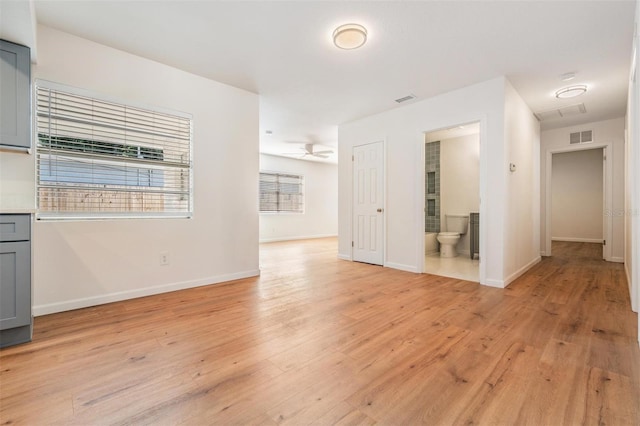 spare room featuring ceiling fan and light wood-type flooring