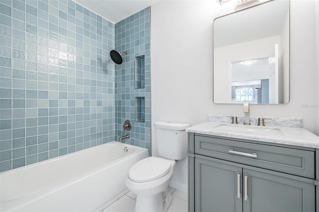 full bathroom featuring tiled shower / bath combo, vanity, and toilet