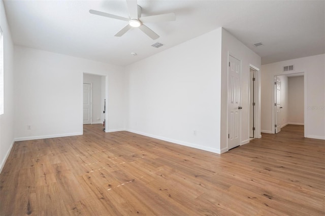 unfurnished room with ceiling fan and light wood-type flooring