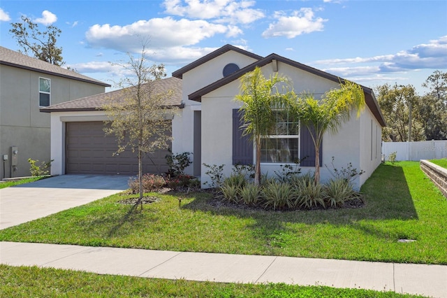 view of front of home with a garage and a front yard