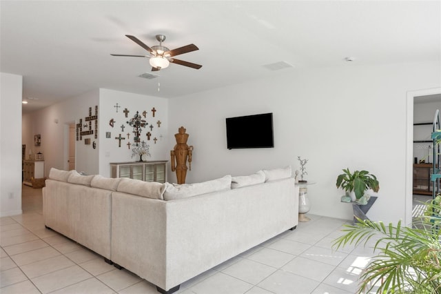 living room featuring light tile patterned floors, visible vents, and ceiling fan