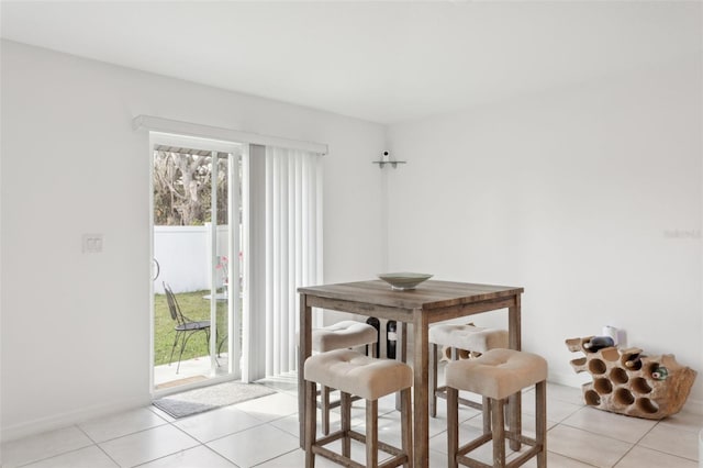 dining area with light tile patterned floors