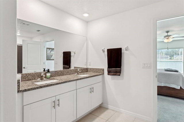 bathroom featuring tile patterned flooring, vanity, and ceiling fan