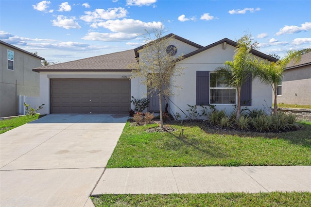 single story home featuring stucco siding, a front yard, concrete driveway, and an attached garage