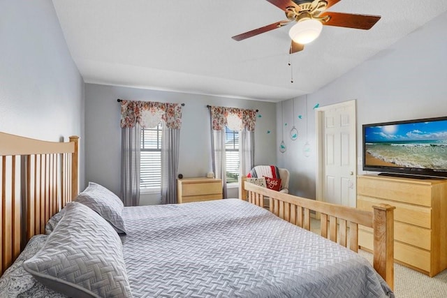 bedroom featuring lofted ceiling, ceiling fan, and carpet flooring