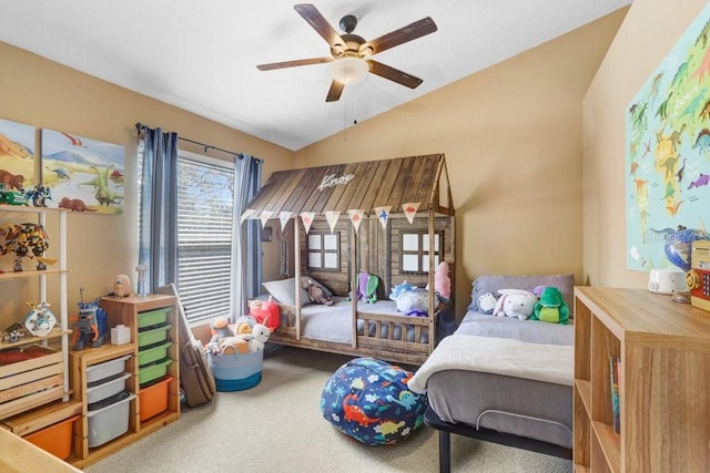 carpeted bedroom featuring lofted ceiling and ceiling fan