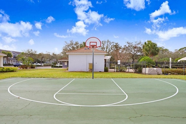 view of basketball court featuring a lawn