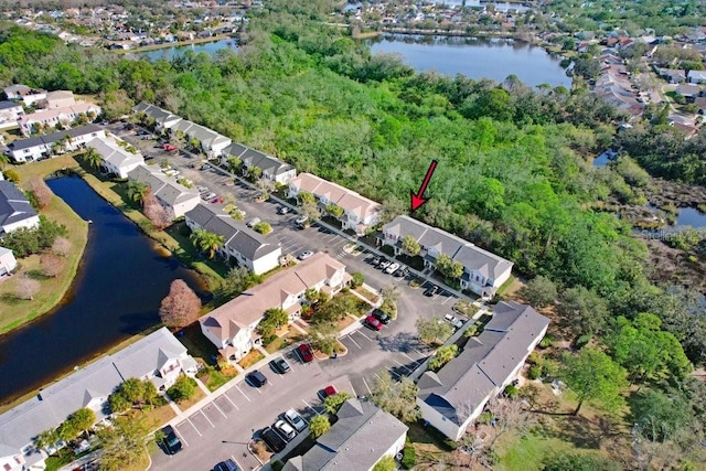 birds eye view of property featuring a water view