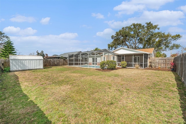 view of yard featuring a storage shed and a fenced in pool