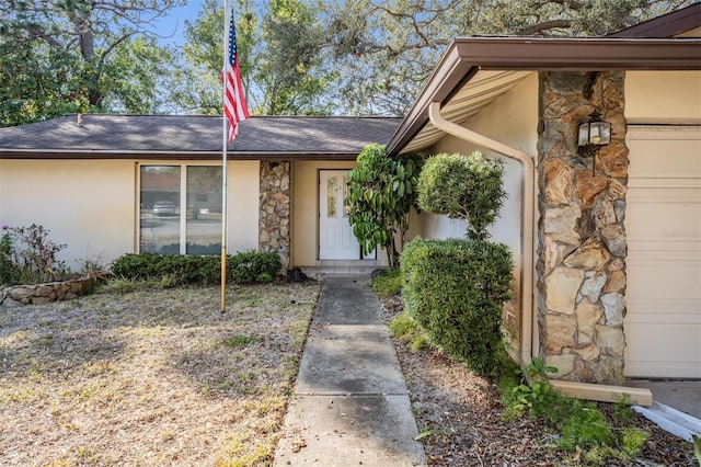 property entrance featuring a garage