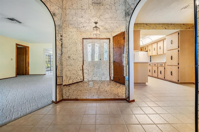 interior space with light tile patterned floors