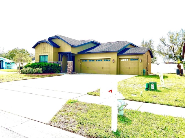 view of front facade with a garage, concrete driveway, central AC, and a front lawn