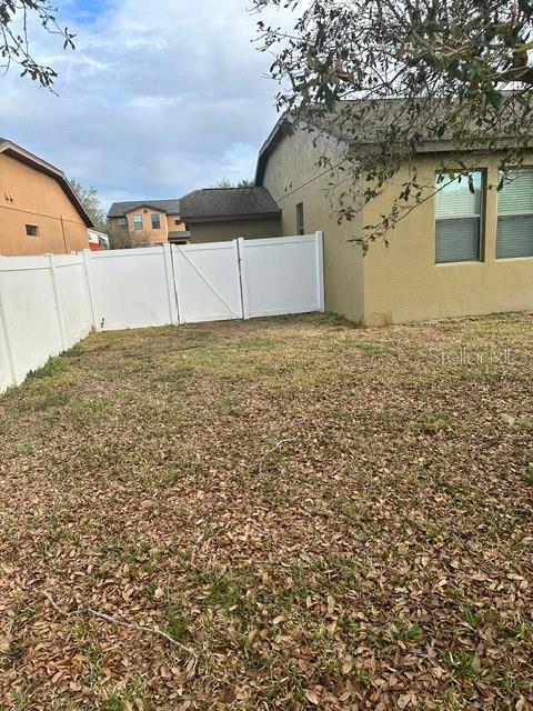 view of yard featuring fence