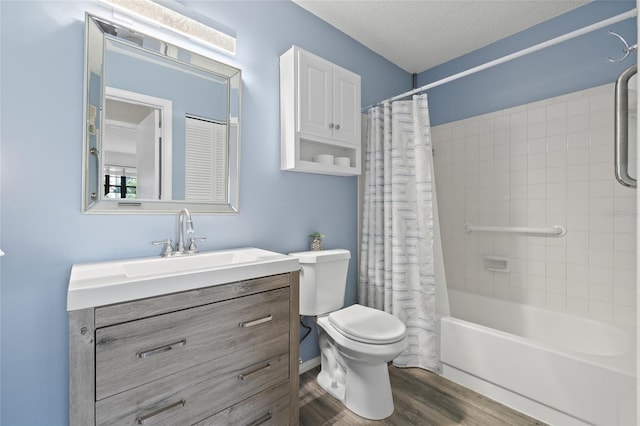 full bathroom with hardwood / wood-style flooring, vanity, toilet, shower / bathtub combination with curtain, and a textured ceiling