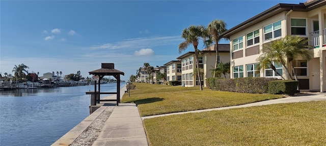 surrounding community featuring a yard, a gazebo, and a water view