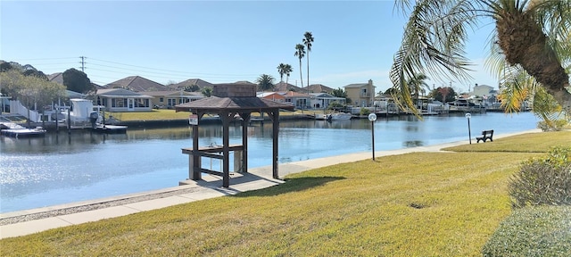 dock area featuring a yard, a gazebo, and a water view