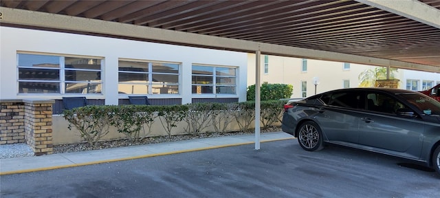 view of car parking featuring a carport