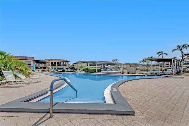 view of swimming pool featuring a patio