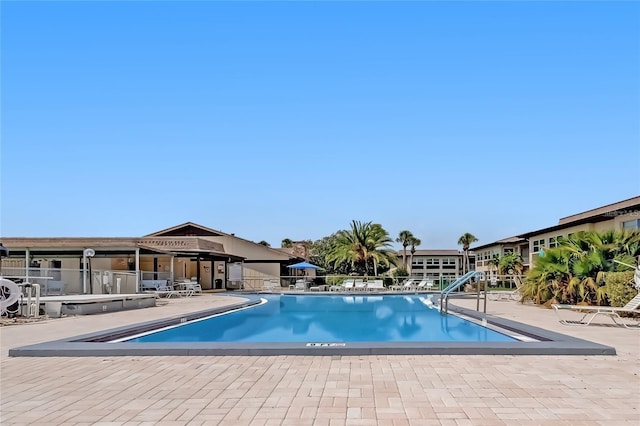 view of pool featuring a patio