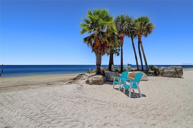 property view of water featuring a beach view