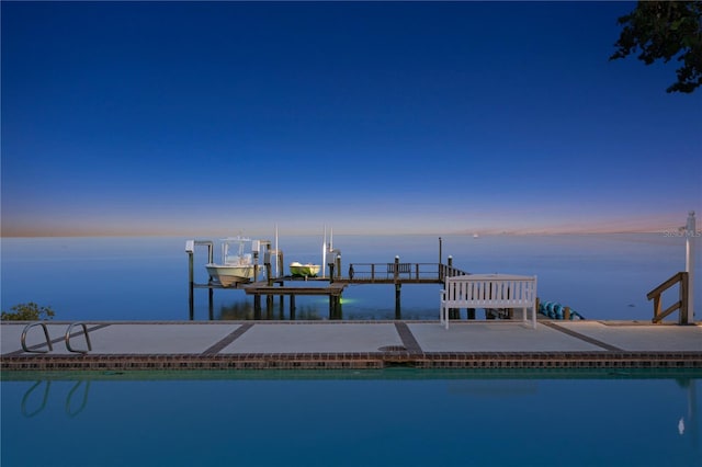 dock area with a water view