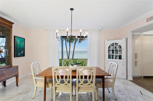 dining space featuring ornamental molding, a wealth of natural light, and a notable chandelier