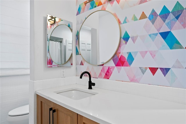 bathroom with vanity and toilet