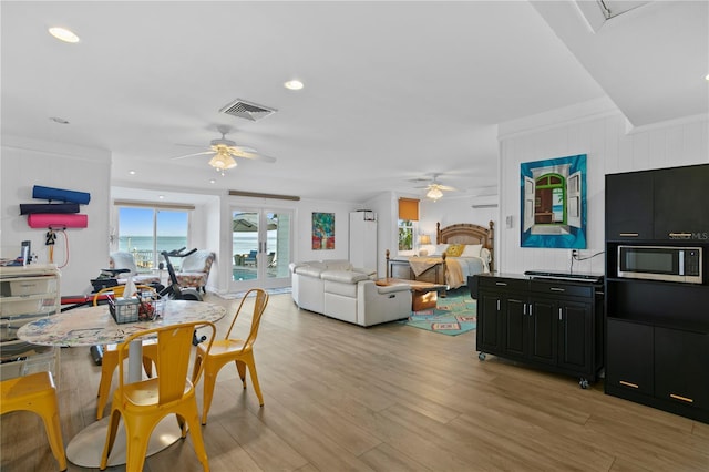 dining area featuring ceiling fan and light hardwood / wood-style flooring