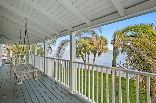 deck featuring a water view and a yard